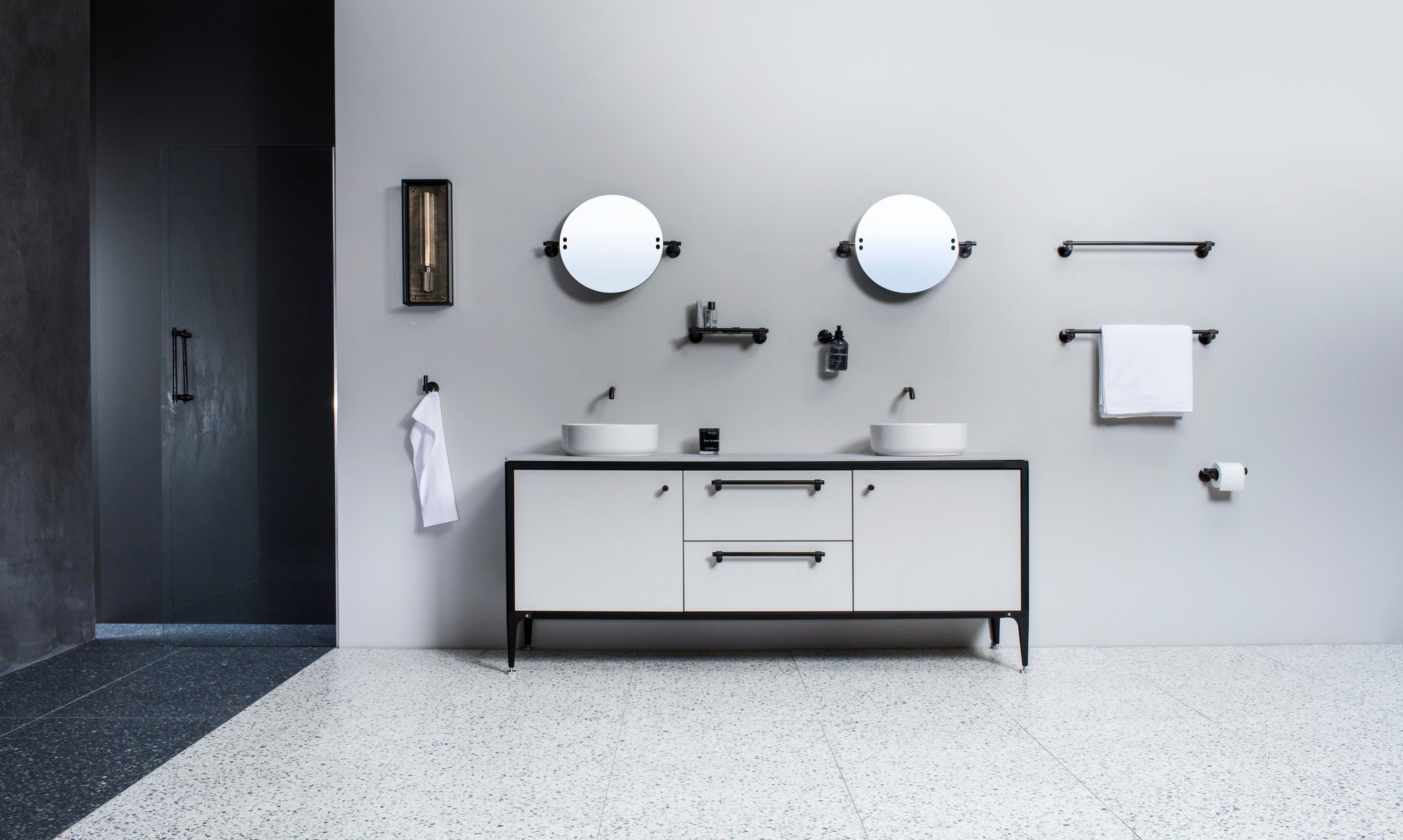 A bathroom with Buster & Punch bathroom furniture and accessories as mirrors, lamps etc.
