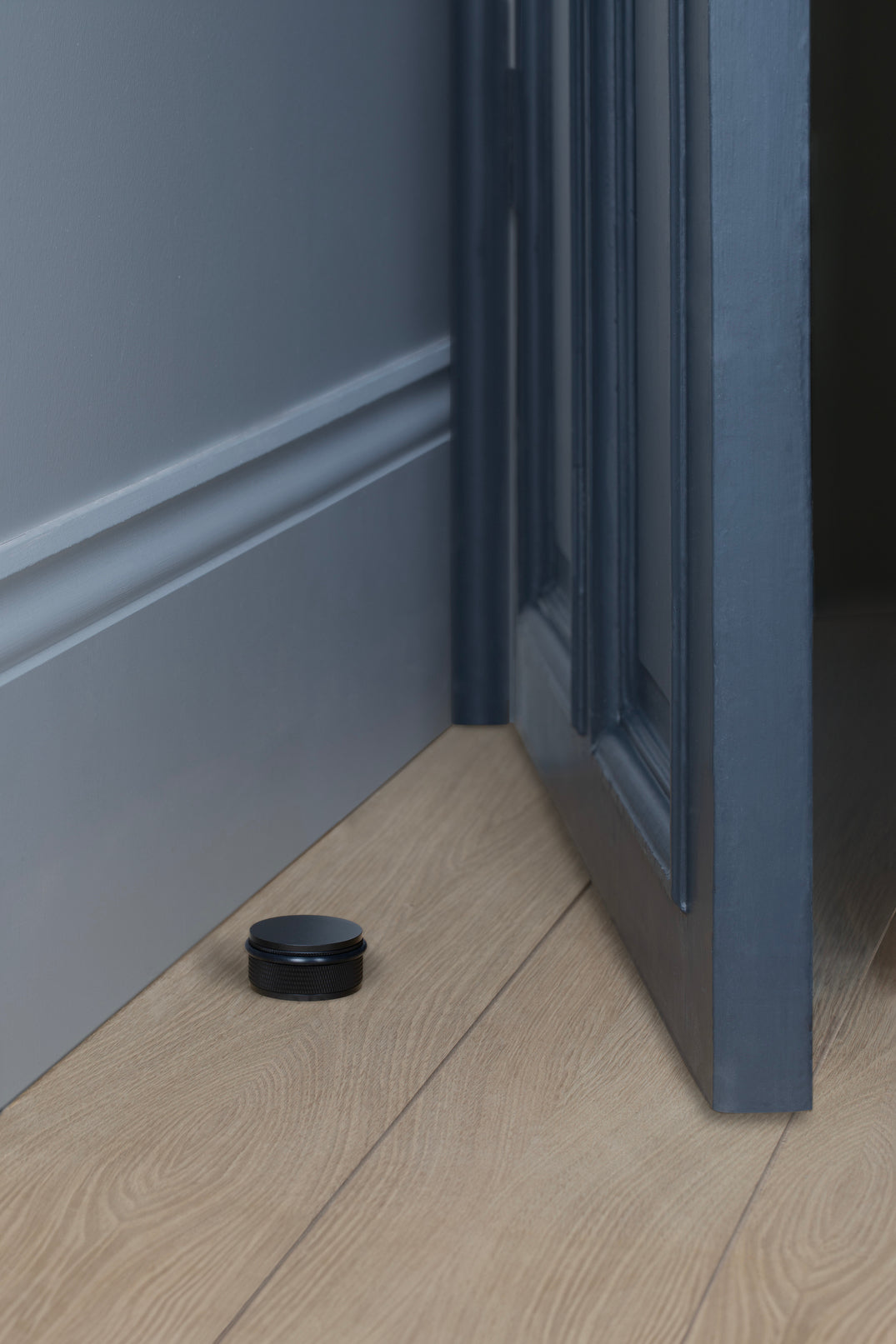 DØRSTOPPER / GULV / SORT