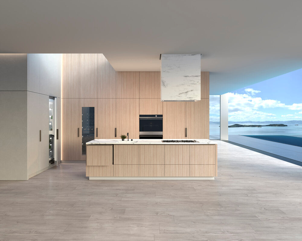 Modern kitchen with wooden cabinets, integrated appliances from Buster & Punch and a view of the ocean.
