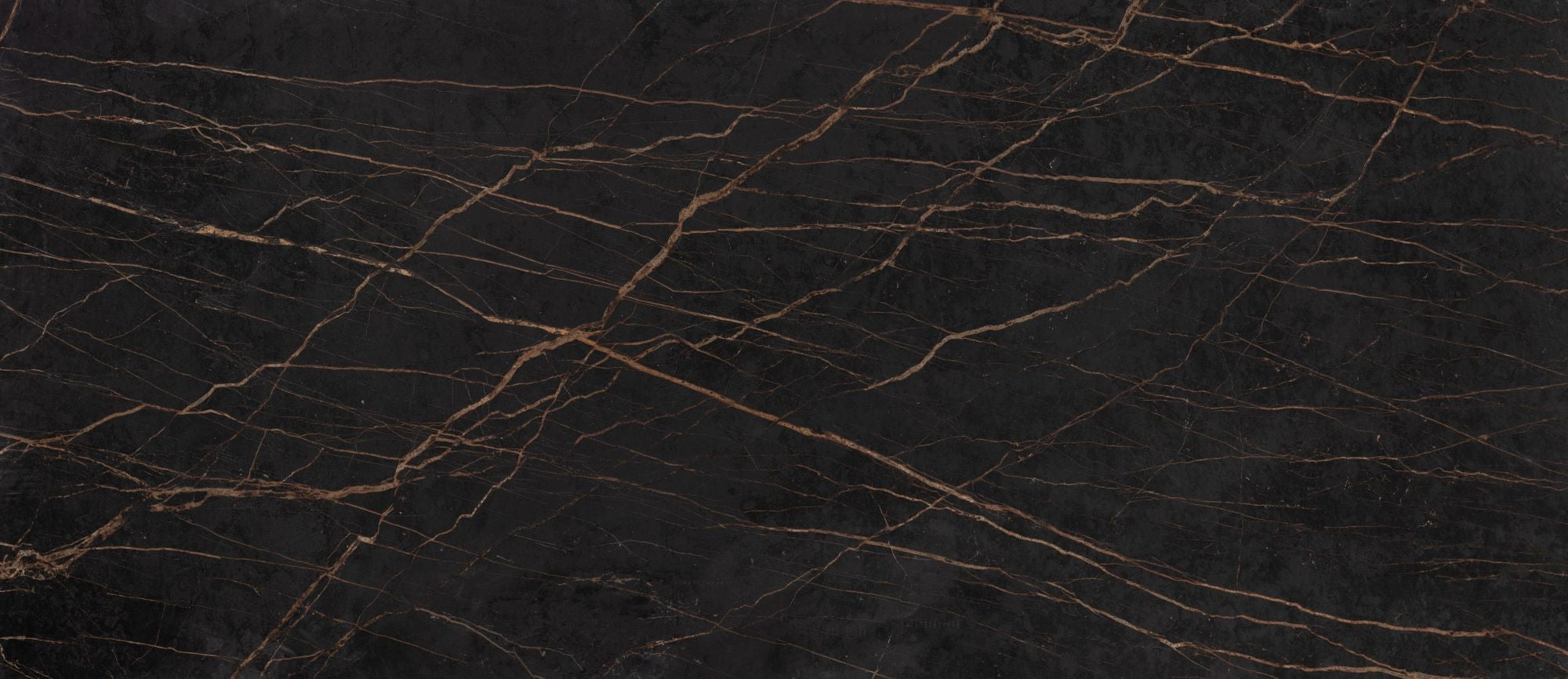 Dekton laurent worktop is dark with visible golden veins