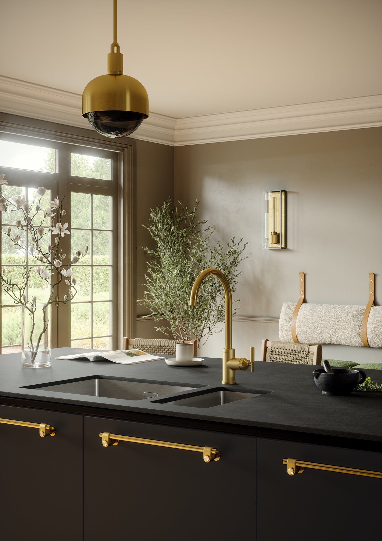 Modern Buster & Punch kitchen with dekton argentium countertops, brass fixtures, and a pendant light.