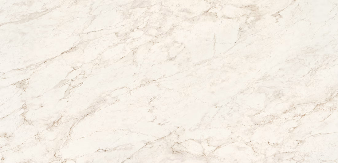 A close-up of a light beige Eclos by Cosentino surface with soft white and warm gray veining across the full frame.
