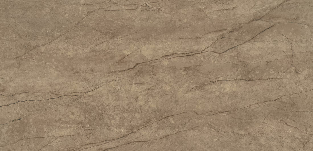 A close-up of a textured stone or concrete surface in warm taupe-brown with subtle gray veining and natural mottling.