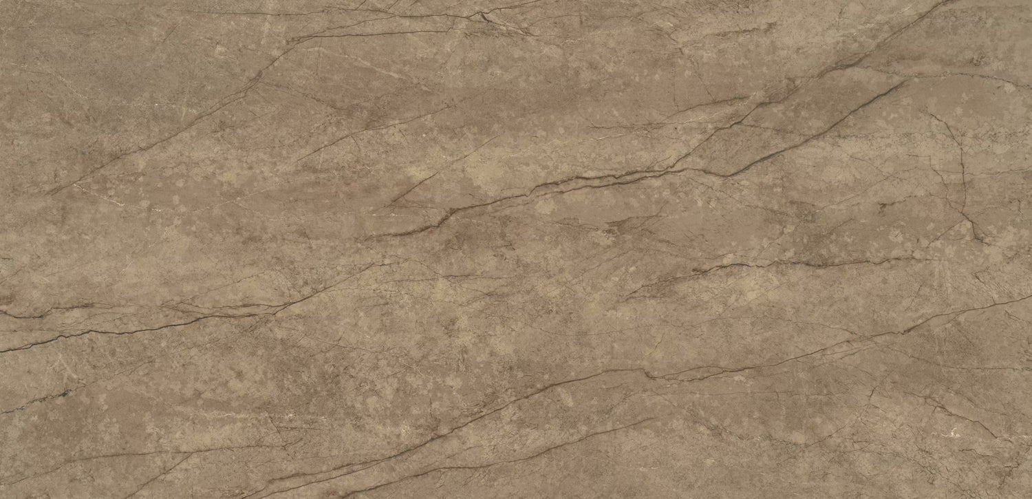 A close-up of a textured stone or concrete surface in warm taupe-brown with subtle gray veining and natural mottling.