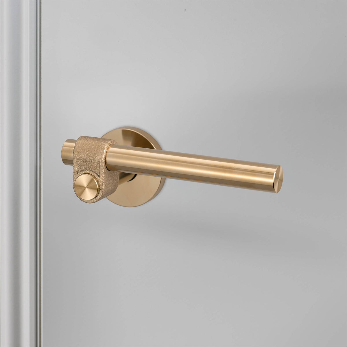 Buster + Punch Cast sprung door handle set in brass – view 1