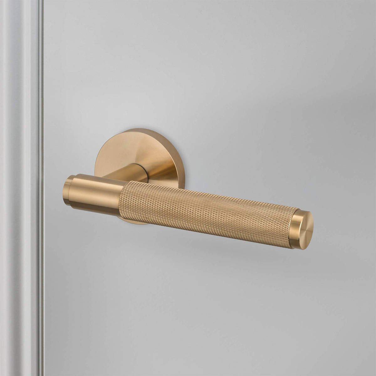 Buster + Punch door handle set / cross / swe / sprung – brass